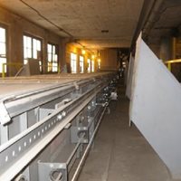 Sistema de distribución para descarga accesorio móvil, cerrado y automatizado Consignor®